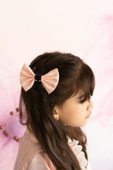 Peach bow hair accessory